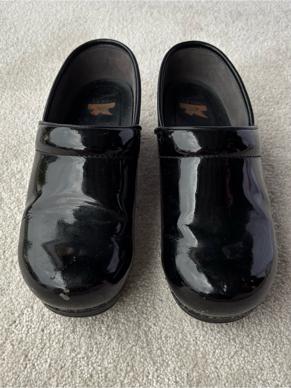 Dansko Women's Black Patent Leather Clogs